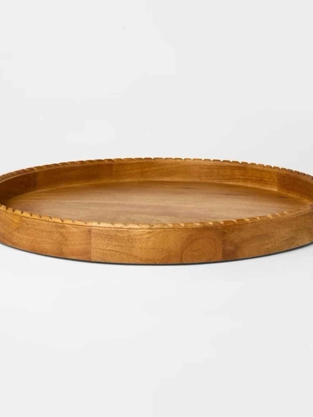 Threshold Carved Edge Round Wood Serving Tray in Warm Brown